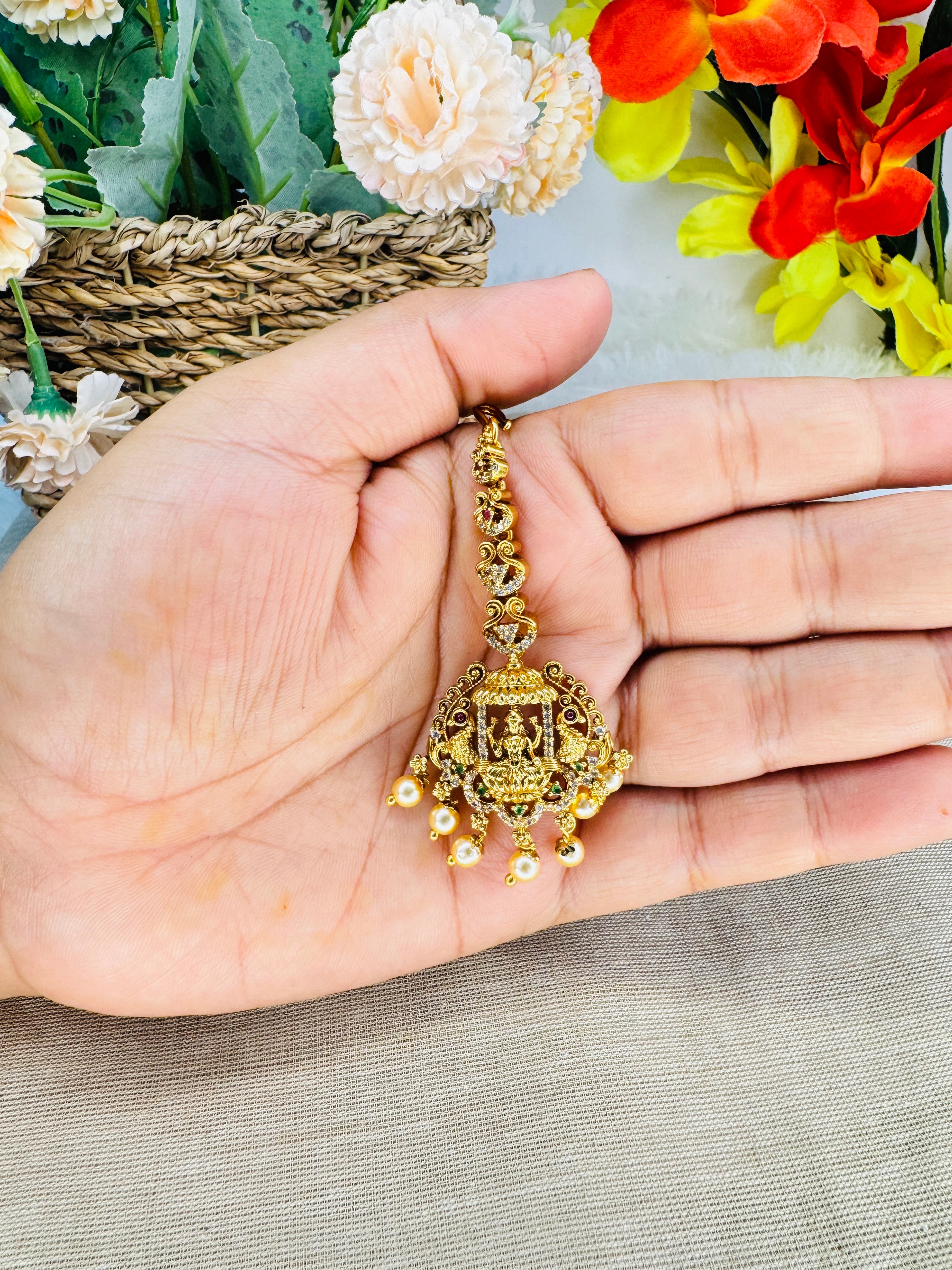 The Devangana Lakshmi Maang Tikka in Antique Gold